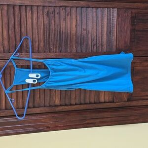 Blue small gym top with open sides, built in unlined bra